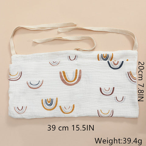 White fabric band with rainbow patterns, measuring 39 cm by 20 cm, weighs 39.4g. Comes with beige straps. Multicolored U-shapes are evenly distributed across the material.