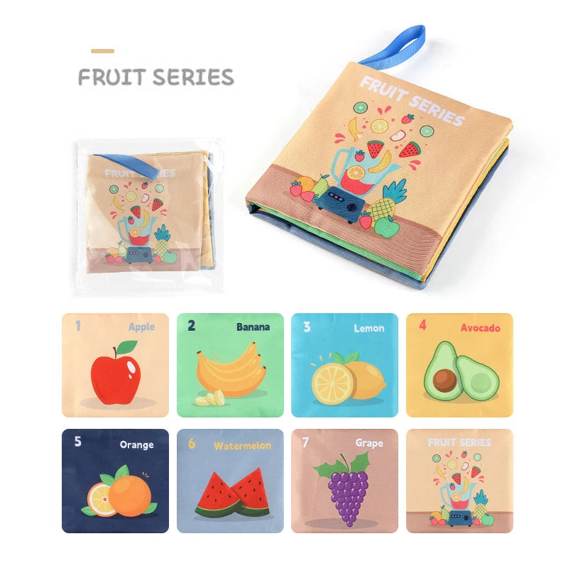 Illustrated fabric book titled "Fruit Series" featuring playful images of fruits including apple, banana, lemon, avocado, orange, watermelon, and grape.