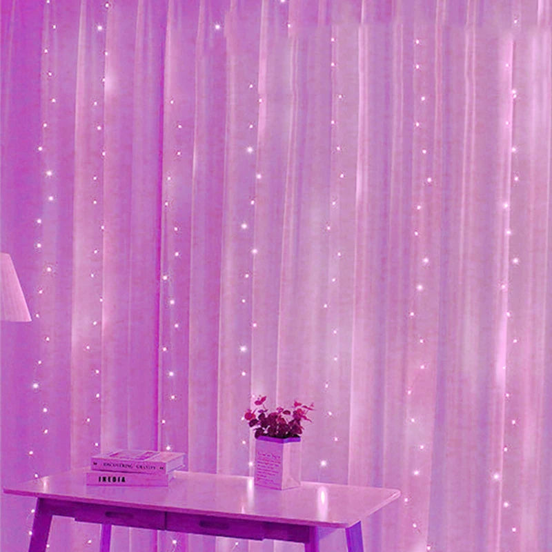 Pink curtains adorned with small, twinkling fairy lights create a dreamy ambiance. A table in the foreground holds a small plant and a few books, completing the serene setting.