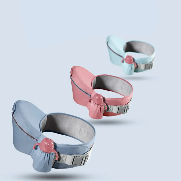 Three colorful baby carrier belts with built-in bottle holders arranged in a staggered line on a light blue background. The belts are in blue, pink, and light blue.