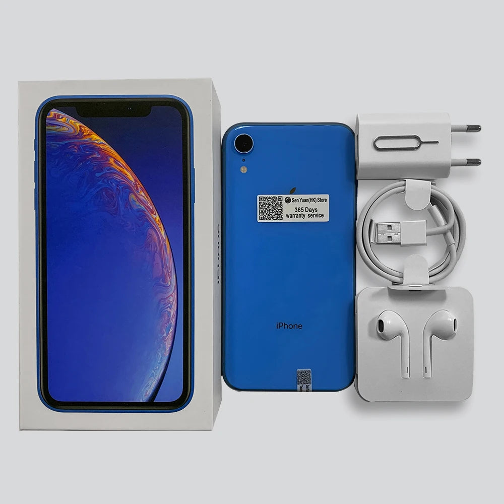Blue smartphone with packaging, a box showing the screen, earbuds, a charging cable, USB adapter, and SIM card tool. Warranty sticker on phone back.