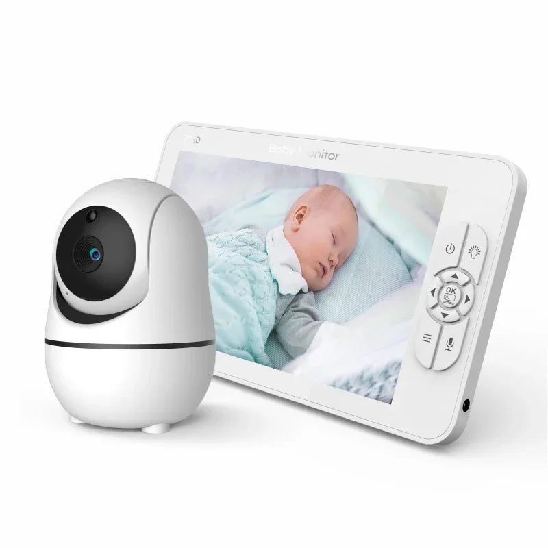 Baby monitor with a camera and a screen displaying a sleeping infant. The monitor features control buttons on the side, set against a white background.