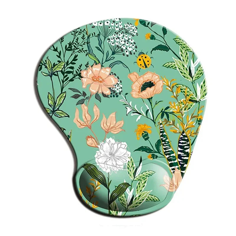 Mouse pad with a floral design on a green background, featuring various colorful flowers, leaves, and a ladybug motif.