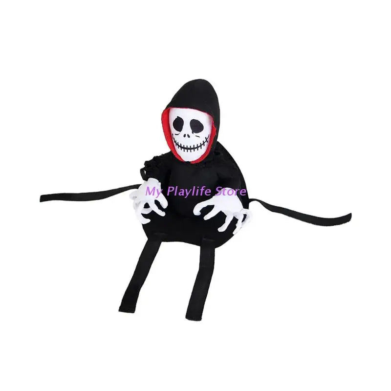 A cute Halloween plush toy featuring a smiling skull face with a red-lined black hood and skeletal hands, positioned on a flat black base with straps attached.