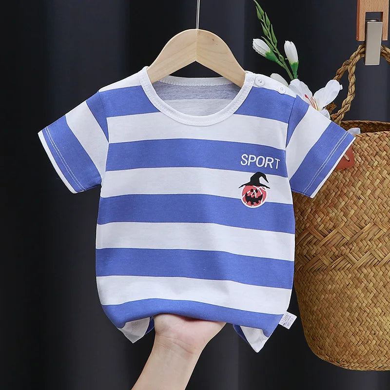 Blue and white striped baby shirt with "SPORT" above a pumpkin with a witch hat design on the front. The shirt is held on a wooden hanger against a dark background.