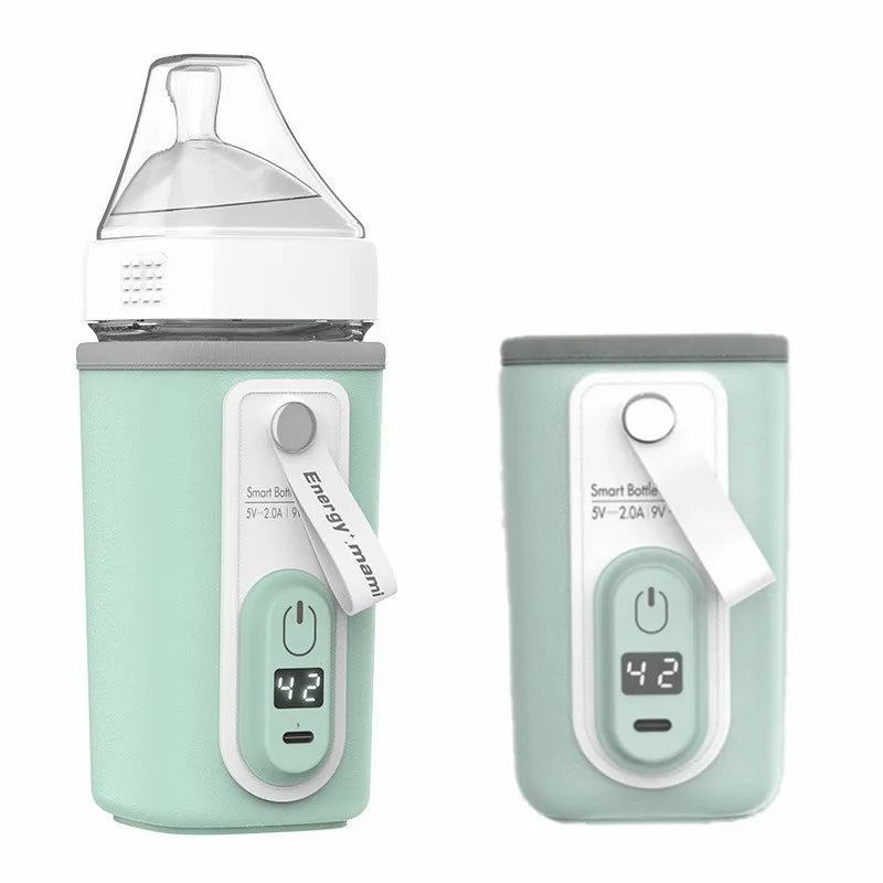 Two mint green smart baby bottles with digital displays showing "42". One has a silicone nipple, the other a cover. Both bottles feature a white strap labeled "Energy mama" and power button.