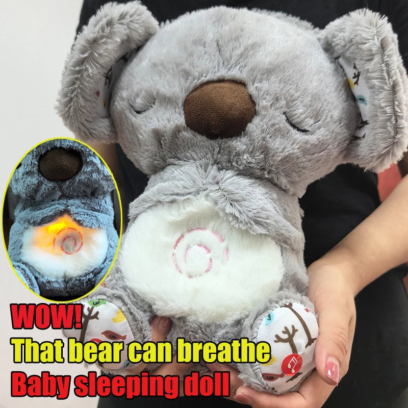 A plush gray bear toy with a brown nose, embroidered eyes, and ears with patterns. It has a glowing, simulated breathing effect on its belly. Text on the image says "WOW! That bear can breathe Baby sleeping doll."