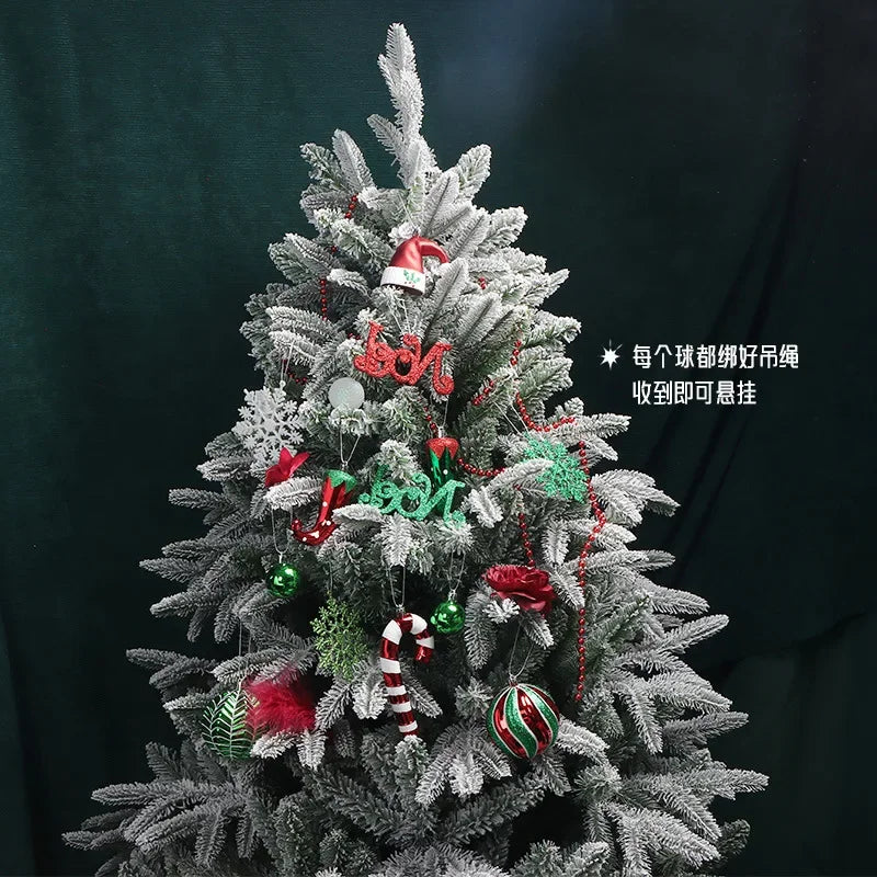 Frosted Christmas tree adorned with red and green ornaments, candy canes, and decorative elements against a dark background, featuring a small Santa hat on top.