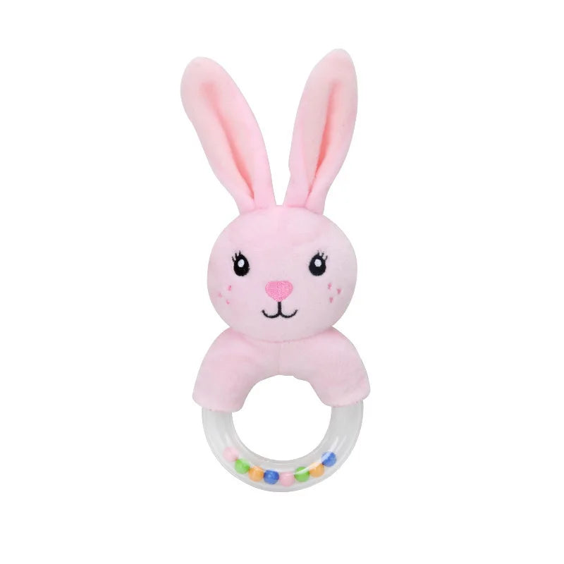 A pink plush bunny rattle with long ears and a smiling face. It has a clear plastic handle filled with colorful beads, designed for infants.