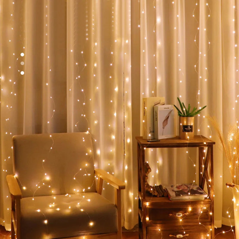 Cozy room with warm fairy lights draped over curtains, a beige armchair, and a wooden shelf holding books and a potted plant. The ambiance is soft and inviting.