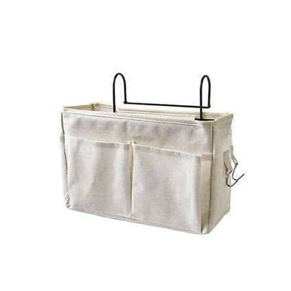 White fabric hanging organizer with two front pockets and a black metal hanger on top, designed for storage and organization.