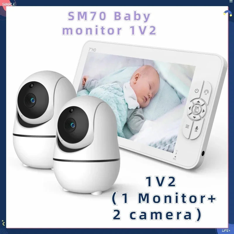 Two white cameras and a monitor displaying a sleeping baby. Text reads "SM70 Baby Monitor 1V2," referring to a set with one monitor and two cameras.