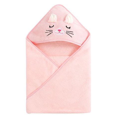 A soft pink baby towel with a hood designed to look like a sleeping cat face, complete with closed eyes, whiskers, and 3D ears. The towel is folded neatly with the hood on top.