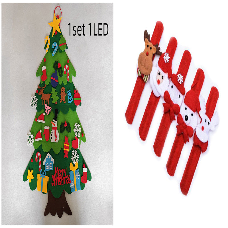 Felt Christmas tree with LED star, decorated with festive ornaments. Beside it, five red slap bracelets featuring various holiday characters like reindeer and Santa, with bows and snowflakes.