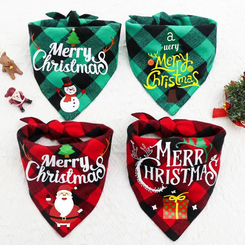 Four plaid Christmas-themed bandanas with holiday greetings and festive designs, displayed alongside small Santa and reindeer figurines on a white background.
