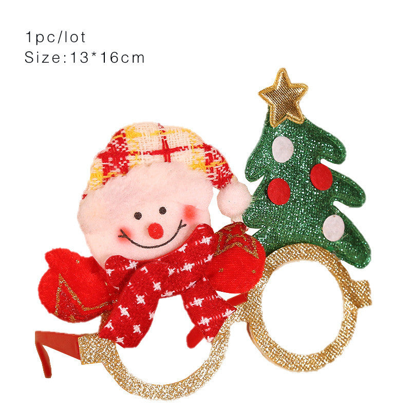 Festive novelty glasses featuring a smiling snowman in a red scarf and hat, alongside a glittery Christmas tree with a gold star. Glasses are gold with round frames.