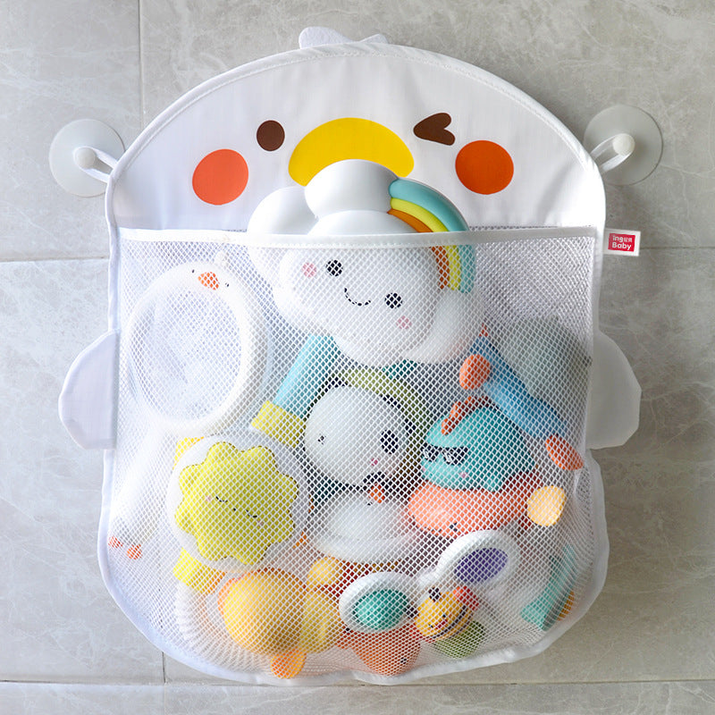 A white mesh bath toy organizer with colorful cartoon cloud and rainbow design on a grey tiled wall, filled with various shaped and colored bath toys, secured by suction cups.