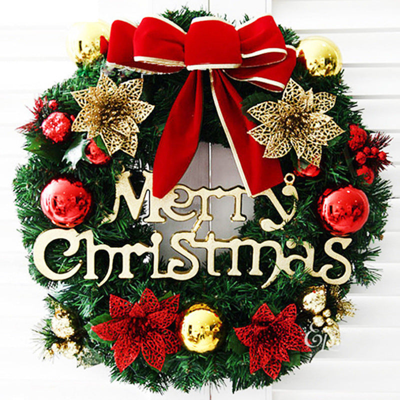 Festive Christmas wreath with gold "Merry Christmas" text, red and gold baubles, poinsettias, and a large red bow, set against a white background.
