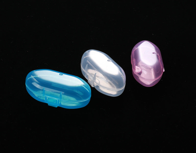 Three translucent plastic cases in blue, clear, and pink, arranged on a black background. Each has an oval shape and a small latch for closure.
