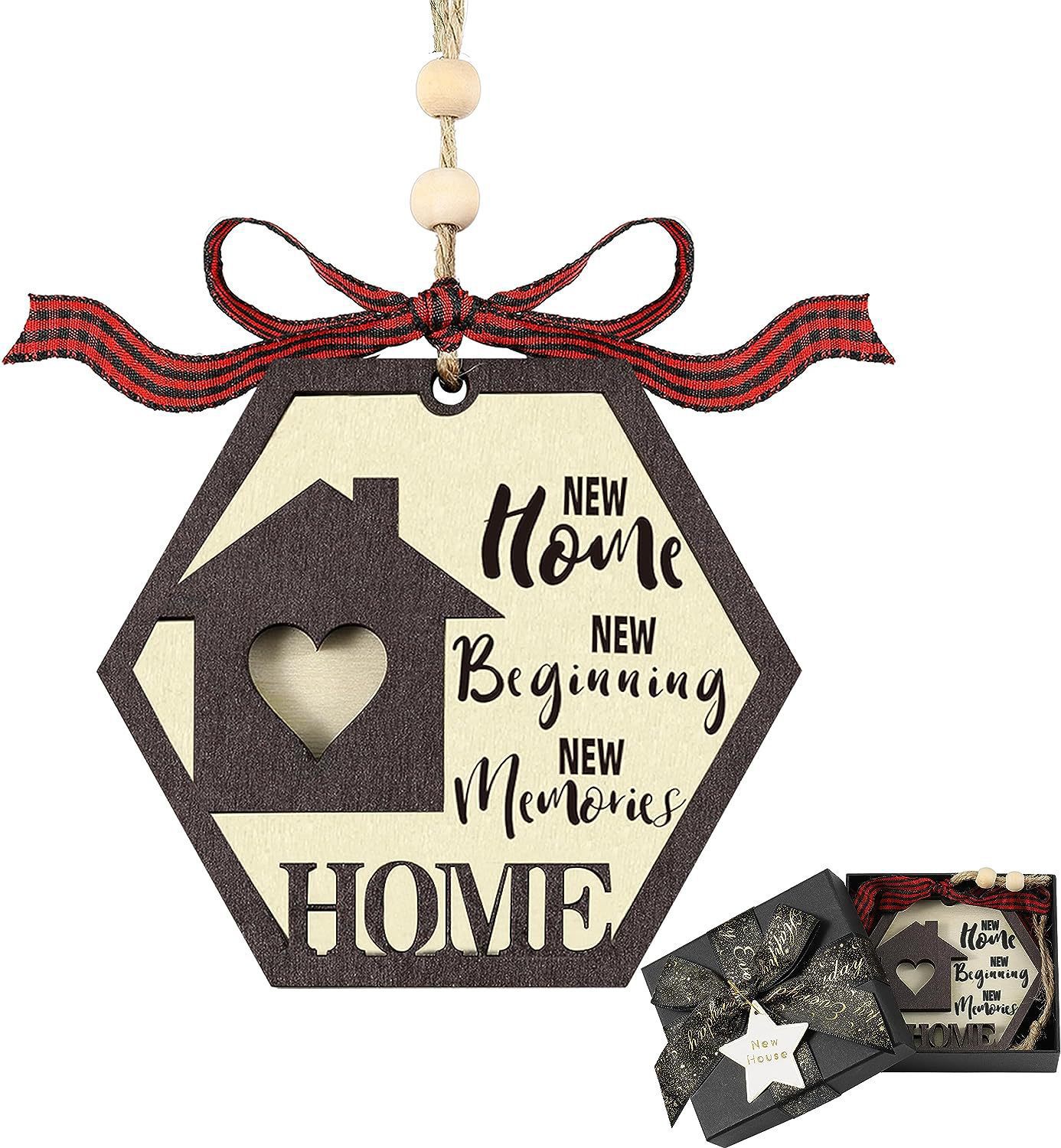 Hexagonal wooden ornament with a house and heart cutout, red plaid ribbon, inscribed with "New Home, New Beginning, New Memories." It includes a gift box with a bow.