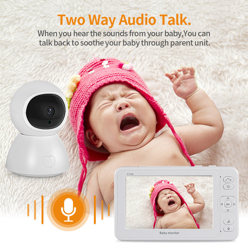 A crying baby wearing a pink hat is displayed on a baby monitor screen. The monitor offers two-way audio talk, allowing parents to soothe the baby by speaking through the device.
