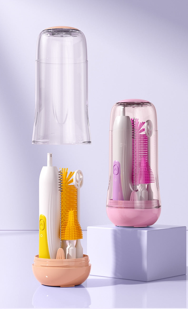 Compact cleaning kit with brushes and nozzles in a transparent case. One kit displays yellow accessories on a peach base, the other pink accessories on a pink base.