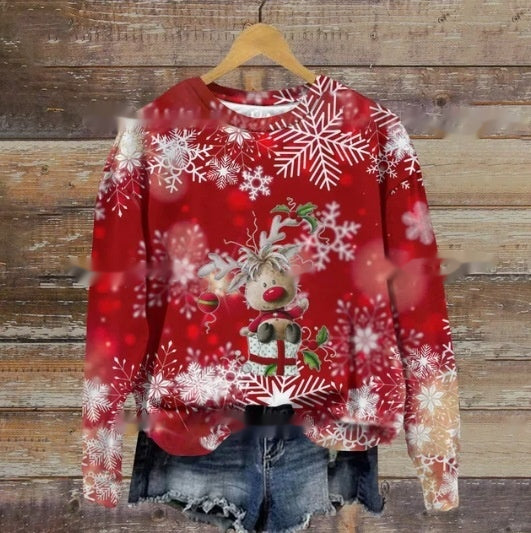 Red Christmas sweater with a reindeer and snowflakes, paired with denim shorts. The festive sweater features a cheerful reindeer design, surrounded by white snowflakes.