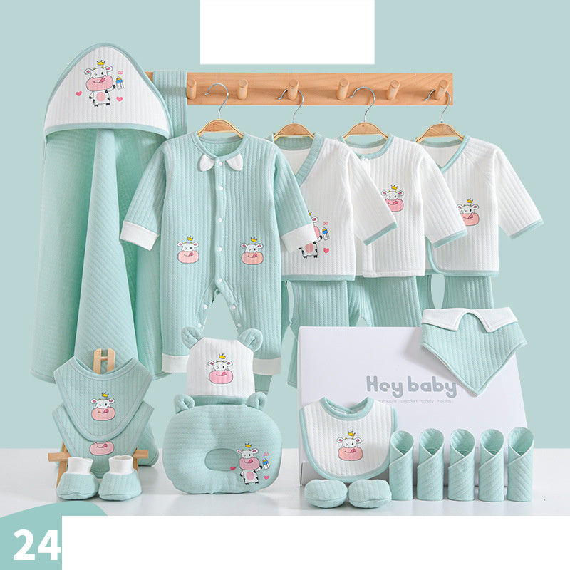 A set of mint green and white baby clothing and accessories featuring a cute hippo design, including onesies, bibs, gloves, hats, towels, and a comfy pillow.