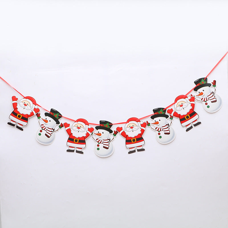 Festive Christmas garland featuring alternating cutouts of Santas in red suits and snowmen with scarves and hats, hanging on a red string against a white background.