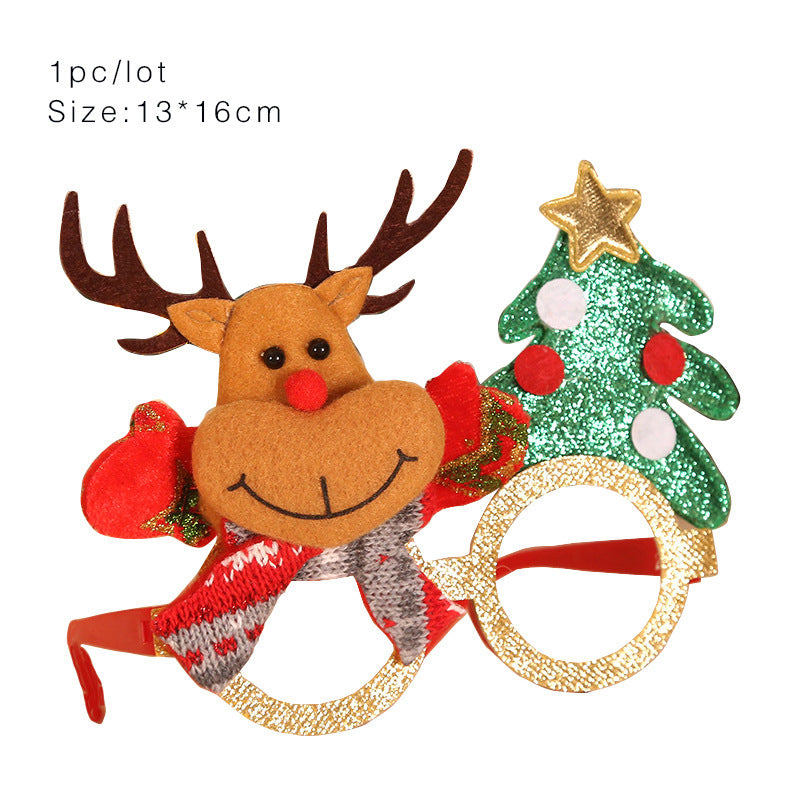 Novelty glasses with gold glitter frames, featuring a smiling reindeer and a green Christmas tree with a gold star. Size and quantity details are printed above.