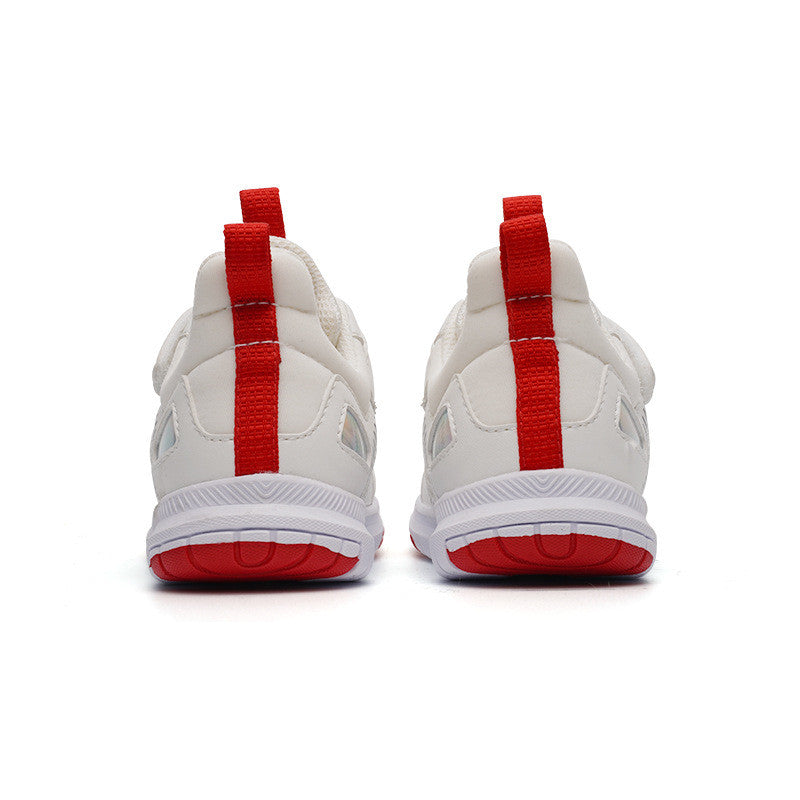 Rear view of white sneakers with bold red stripes and red soles, set against a plain white background. A red pull tab stands vertically on each heel.