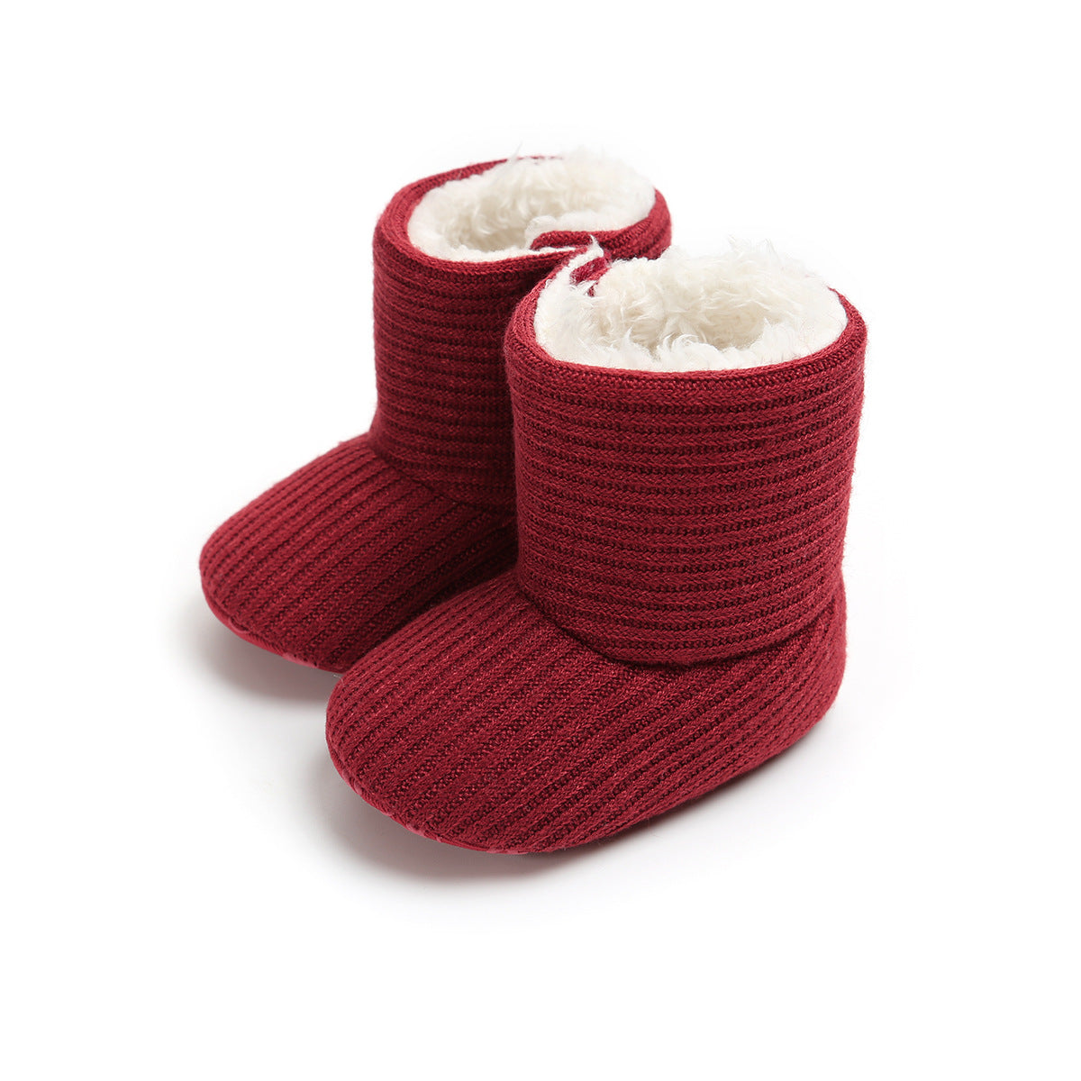 Red baby booties with ribbed texture and white fuzzy lining, standing upright on a white background.
