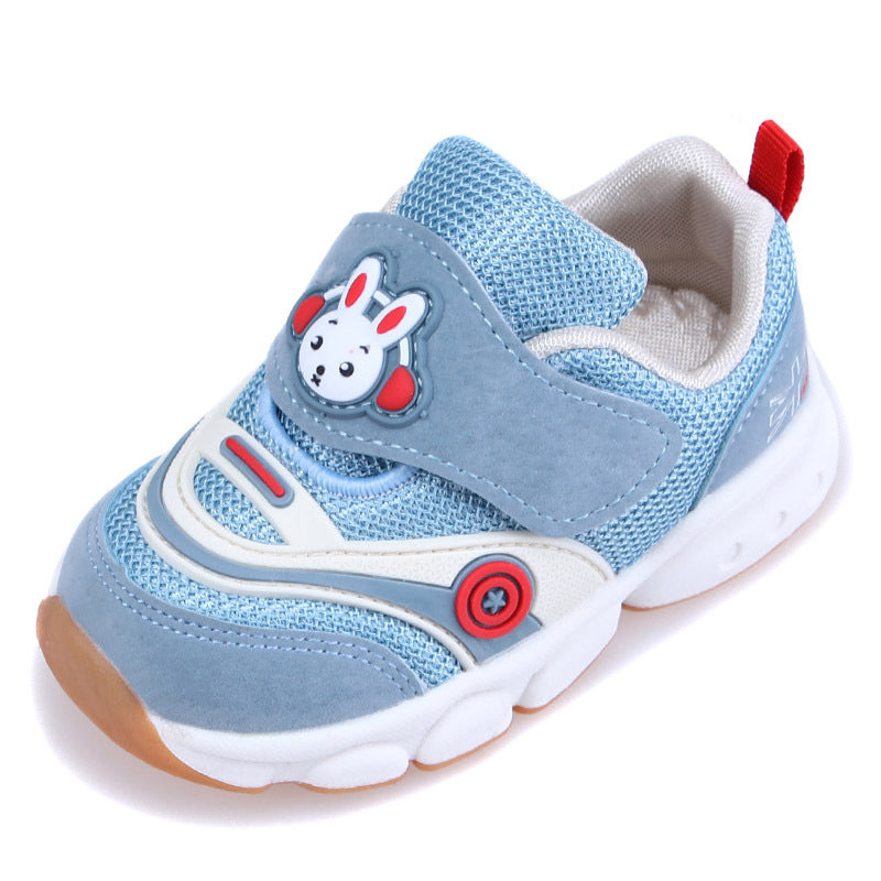 Light blue children's sneaker with a mesh design, featuring a cartoon rabbit on the Velcro strap, red and white accents, and a durable white sole with a red pull tab.