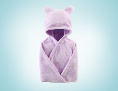 Soft lavender baby robe with a hood featuring bear ears, displayed against a light blue gradient background. The robe is plush and neatly folded, creating a cozy appearance.