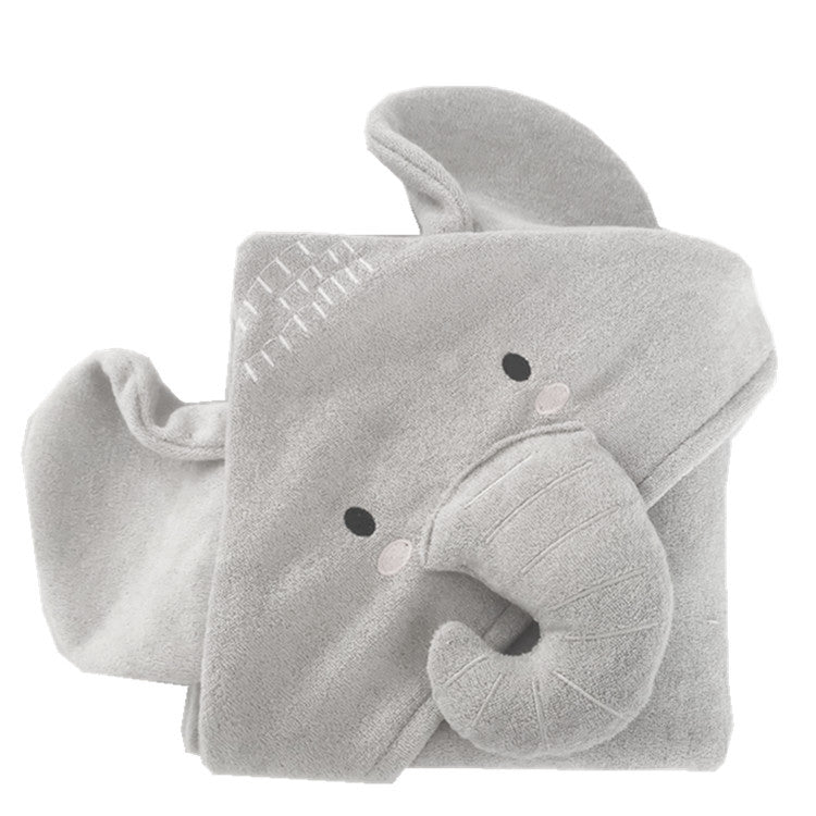 Soft gray baby blanket shaped like an elephant with big ears and a trunk design. The blanket has a textured pattern and gentle facial features for a cute and cozy appearance.