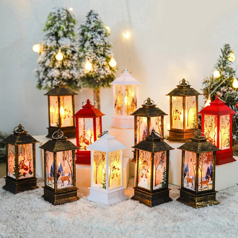 Lit holiday lanterns with festive winter scenes, surrounded by snow and small, decorated Christmas trees with string lights in the background, creating a warm, cozy ambiance.