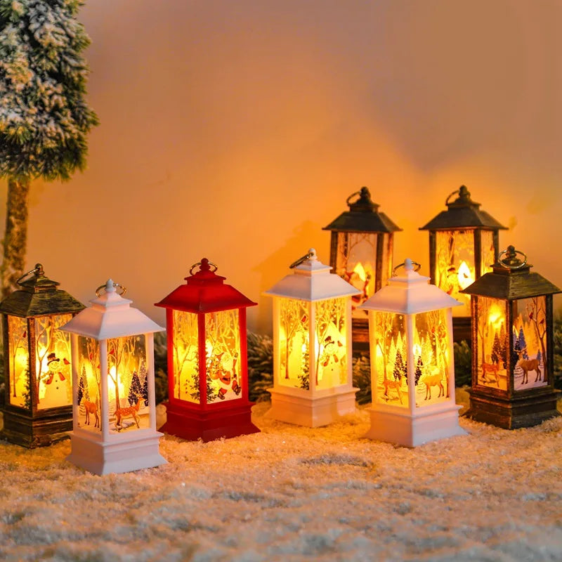 Festive lanterns with glowing lights depict winter scenes, arranged on snow-like surface next to a frosted tree. Colors include white, red, and bronze, creating a warm ambiance.