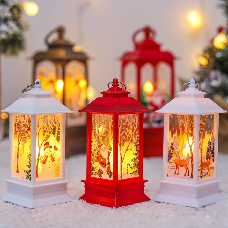 Festive lanterns with Christmas scenes, including snowmen, Santa, and reindeer, glow warmly. The lanterns are red and white, set on faux snow with blurred decorative lights behind.