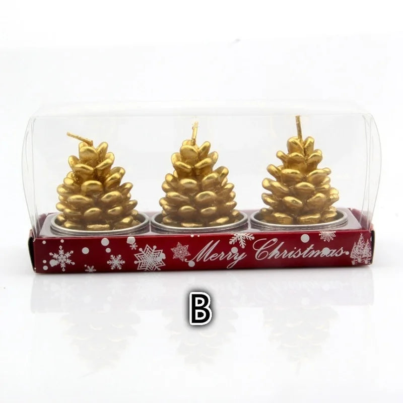 Three gold pine cone candles in a red "Merry Christmas" box with snowflake designs, enclosed in a clear plastic cover. Letter "B" is visible on the image.