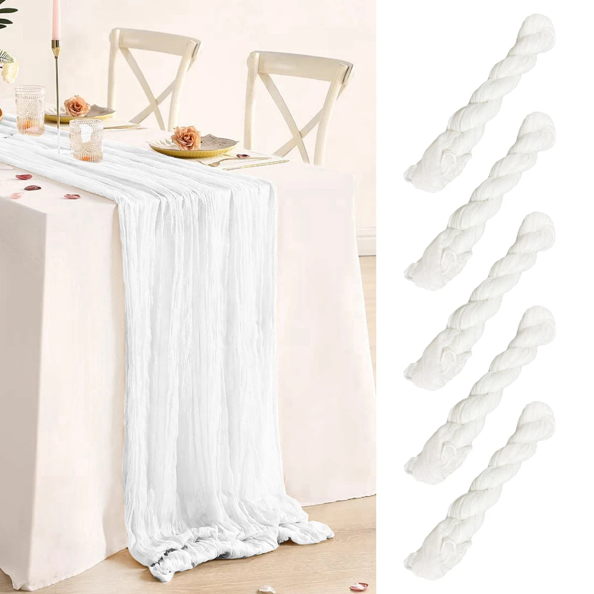 Elegant table setup with a white cheesecloth table runner draping down, accompanied by plates and glasses with floral decor. To the right, four twisted white cheesecloth rolls.