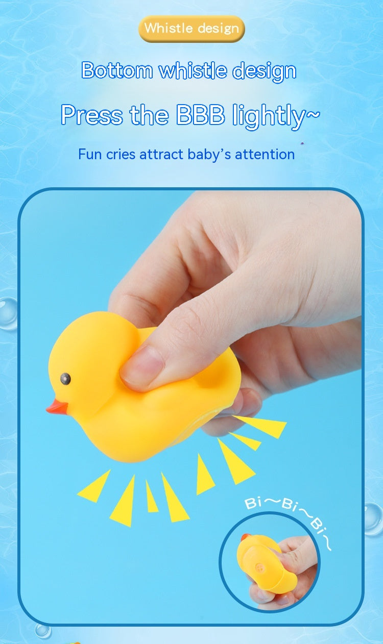 A hand squeezes a yellow rubber duck with a whistle design; text reads "Bottom whistle design, Press the BBB lightly, Fun cries attract baby’s attention," with sound lines depicted.
