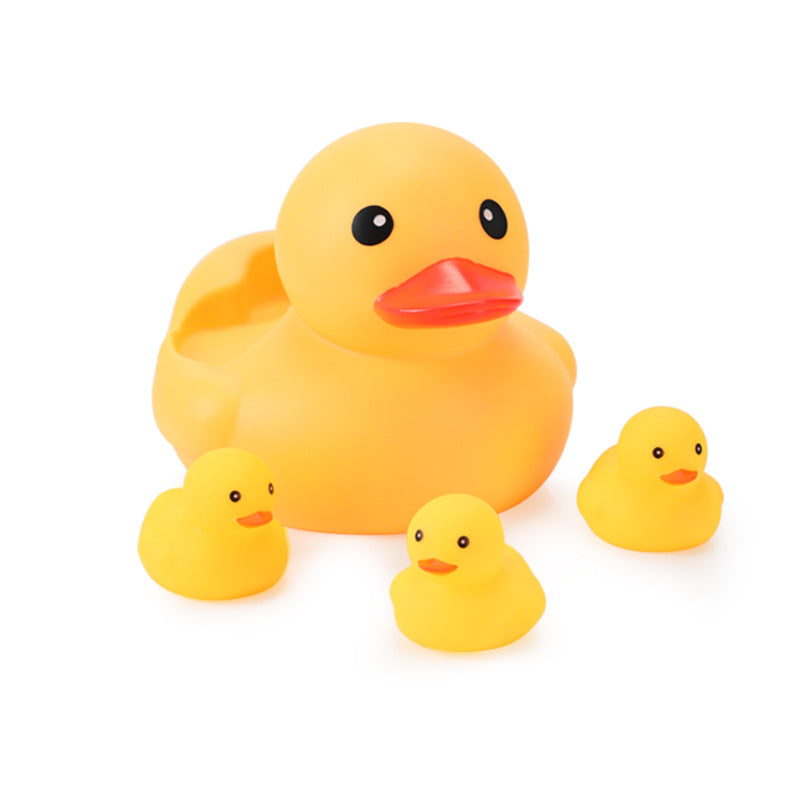 Large yellow rubber duck with red beak surrounded by three smaller ducklings on a white background.