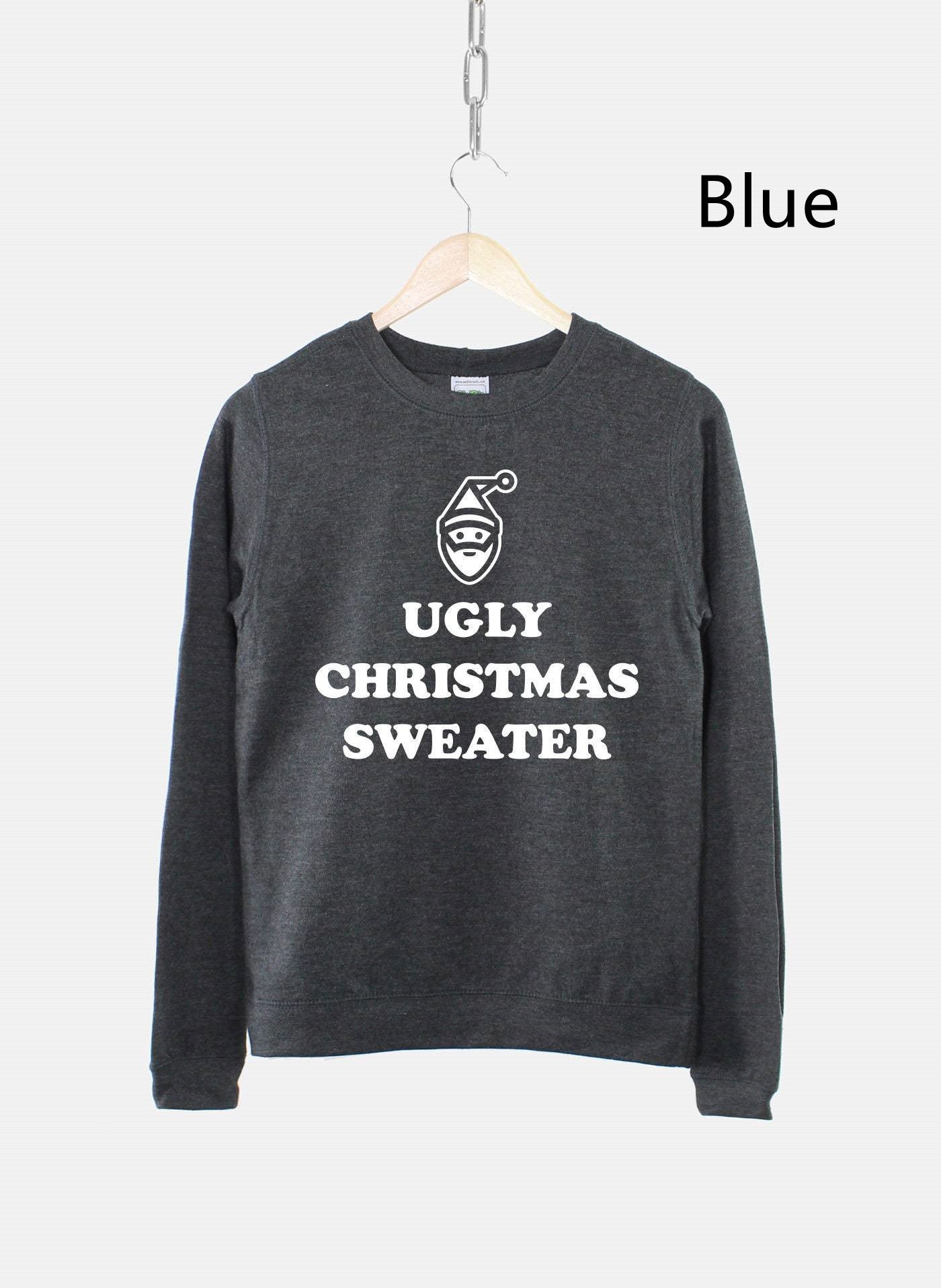 Dark gray sweater on a hanger with "Ugly Christmas Sweater" and a Santa icon printed in white, against a light background.